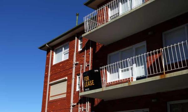 A 'For Lease' sign is displayed on the balcony railings of an apartment