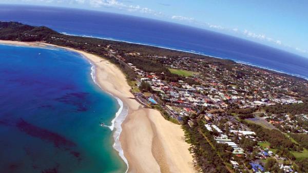 Aussies will still seek out coastal areas like Byron Bay.