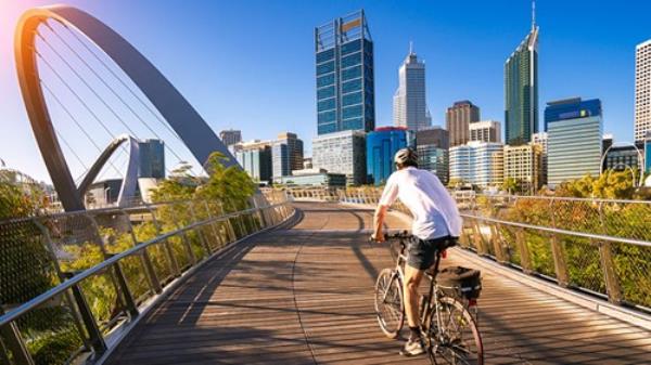 A man cycling in Elizabeth Quay in Perth city, Western Australia