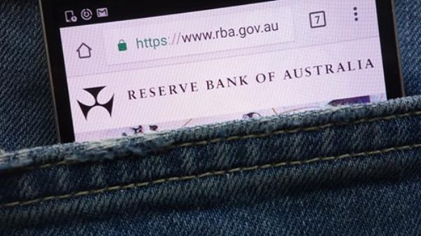 Reserve Bank of Australia (RBA) website displayed on smartphone hidden in jeans pocket