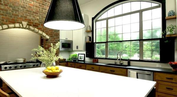 Kitchen window with shutters that slide across the bottom for privacy