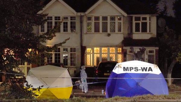 Police at the scene near to Cayton Road, Greenford in west London, where an elderly man who had been riding a mobility scooter was stabbed to death. Picture date: Tuesday August 16, 2022.
