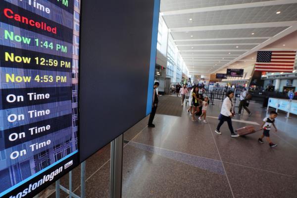 Travelers at Logan Airport ahead of the July 4th holiday weekend in Boston
