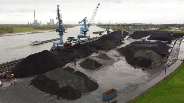Aerial view of a dry bulk terminal with coal along the river Rhine