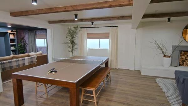 basement with light walls and frosted windows