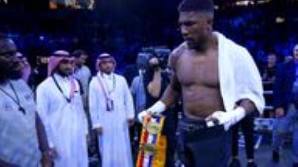Anthony Joshua walks off with the belts after losing the World Heavyweight Championship WBA Super IBF, IBO and WBO fight against Oleksandr Usyk at the King Abdullah Sport City Stadium in Jeddah, Saudi Arabia. Picture date: Saturday August 20, 2022.