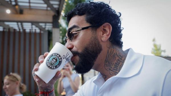 Rapper Timati, co-owner of the new coffee shop "Stars Coffee", which opens following Starbucks Corp company's exit from the Russian market, drinks a coffee, in Moscow, Russia August 18, 2022. REUTERS/Maxim Shemetov
