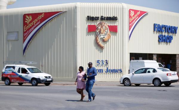 A couple leaves Tiger Brands factory shop in Germiston, Johannesburg