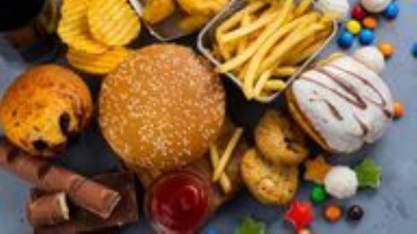 Assortment of unhealthy products that's bad for figure, skin, heart and teeth. Fast carbohydrates food. Pic: iStock