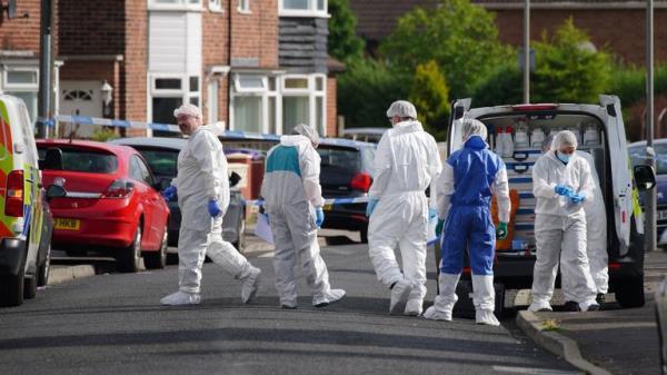 Forensic officers near to the scene in Kingsheath Avenue, Knotty Ash, Liverpool, where a nine-year-old girl has been fatally shot. Officers from Merseyside Police have started a murder investigation after attending a house at 10pm Monday following reports that an unknown male had fired a gun inside the property. Picture date: Tuesday August 23, 2022.

