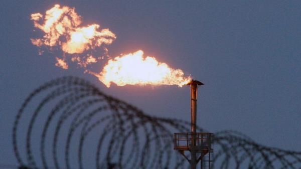 A gas flare burns at the Yuzhno Russkoye oil and gas field, 124 miles from the town of Novy Urengoy, Russia