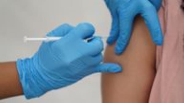 A person receives a Covid-19 jab at a pop-up vaccination centre during a four-day vaccine festival in Langdon Park, Poplar, east London. Picture date: Saturday July 31, 2021.
