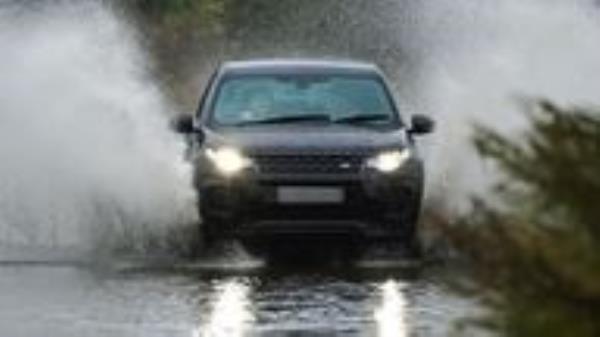 A car goes through floodwater in Whitley Bay, in North Tyneside. Pic: File