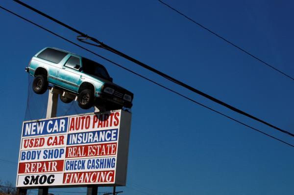 A sign advertising a car dealership is seen in Los Angeles