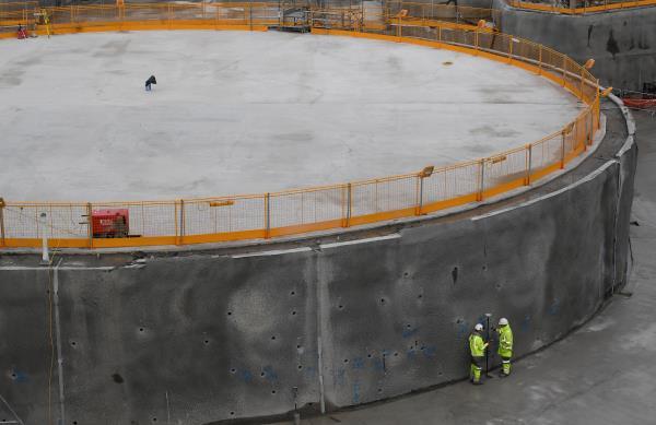 Construction workers are seen beside one of two 'nuclear islands' at the Hinkley Point C nuclear power station near Cannington in southwest England