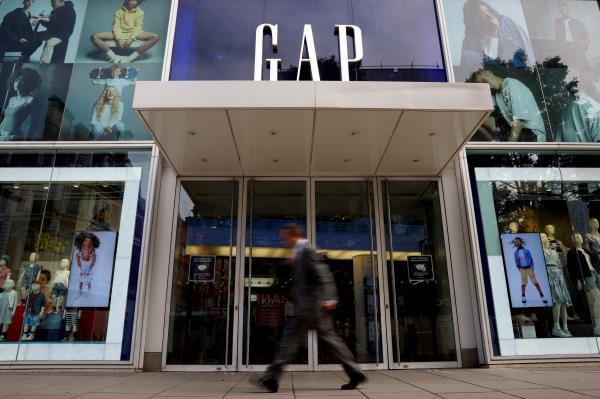 A man walks past a Gap store on Oxford Street in London