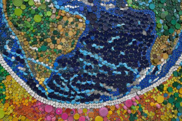 Venezuelan artist Oscar Olivares uses thousands of bottle caps to create colorful eco-mural, in Caracas
