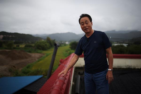 Lee Ung-su speaks during an interview with Reuters at his house near a training field in Pocheon