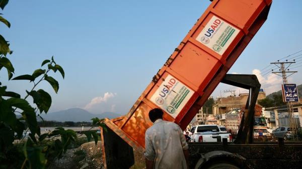 TRUCK DUMPING MUD FROM HOUSES
