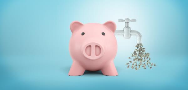  piggy bank with a faucet leaking dollar bills