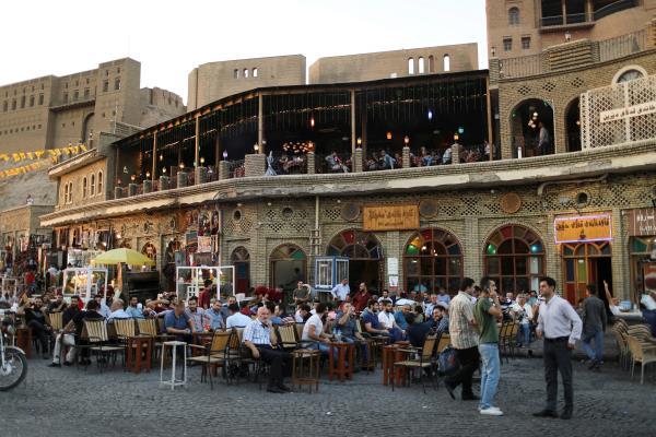 Kurdish people sit in a cafe in the old city of Erbil