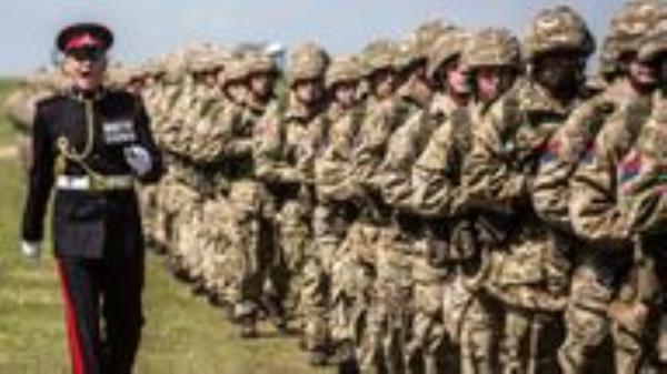 Soldiers of the Royal Artillery march to their positions as they prepare for the arrival of Britain's Queen Elizabeth to their Larkhill camp on Salisbury plain to take part in the Artillery's 300th anniversary celebrations, near Salisbury, Britain. REUTERS/Richard Pohle/Pool