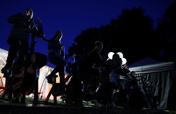 In Warsaw's main central park, a pop-up outdoor cinema invites viewers to pedal stationary bikes