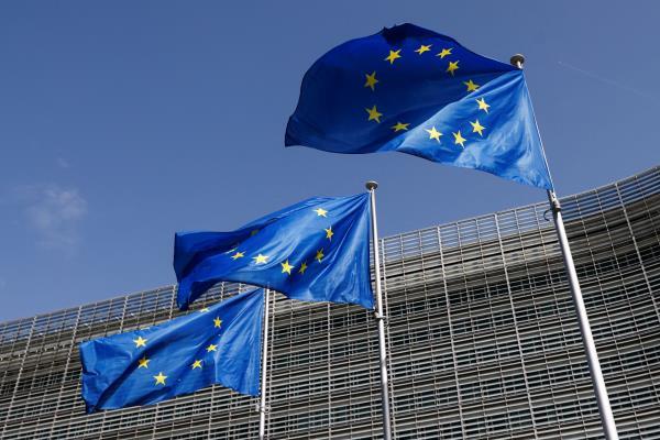 European Union flags flutter outside the EU Commission headquarters in Brussels
