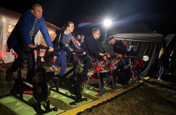 In Warsaw's main central park, a pop-up outdoor cinema invites viewers to pedal stationary bikes