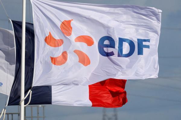 A flag with the EDF logo flies next to the EDF power plant in Bouchain