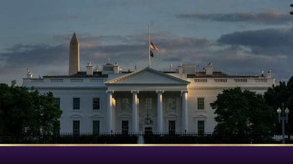 With the Washington Monument in the background, the American flag flies at half-staff over the White House, Thursday, Sept. 8, 2022, in Washington, after Queen Elizabeth II, Britain's longest-reigning monarch and a rock of stability across much of a turbulent century, died Thursday after 70 years on the throne. She was 96. (AP Photo/Gemunu Amarasinghe)