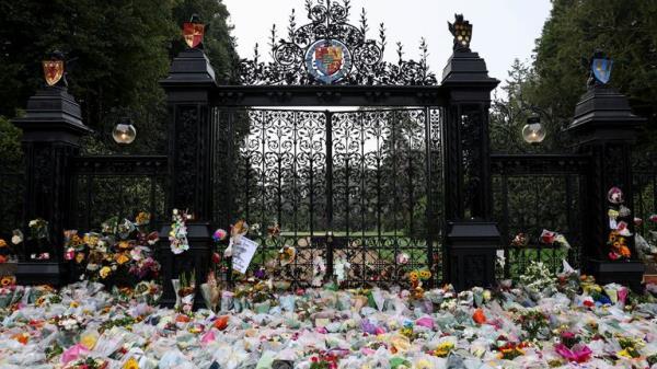 Flowers are pictured at the gate, following the passing of Britain's Queen Elizabeth, at the Sandringham Estate in eastern England, Britain, September 11, 2022. REUTERS/David Klein
