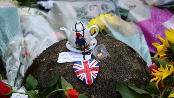 Flowers and memorabilia are pictured at the gate, following the passing of Britain's Queen Elizabeth, at the Sandringham Estate in eastern England, Britain, September 11, 2022. REUTERS/David Klein
