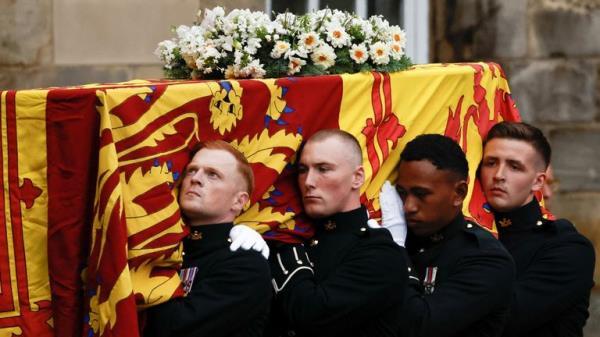 Pallbearers carry the Queen's coffin