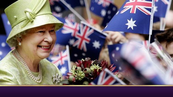 Britain's Queen Elizabeth ll,  left, receives flowers from waiting school childrenwith waiving national flags after the Commonwealth Day Service in Sydney,  Australia, Monday, March 13, 2006. The Queen will open the melbourne Commonwealth Games on March 15, 2006. (AP Photo/Rob Griffith, Pool)
PIC:AP