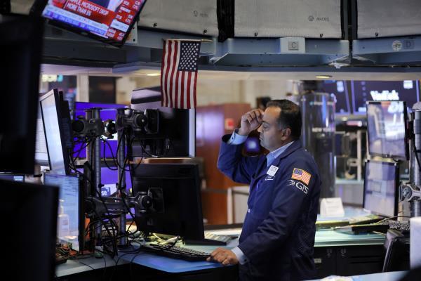 A trader works on the trading floor at the New York Stock Exchange (NYSE) in Manhattan, New York City