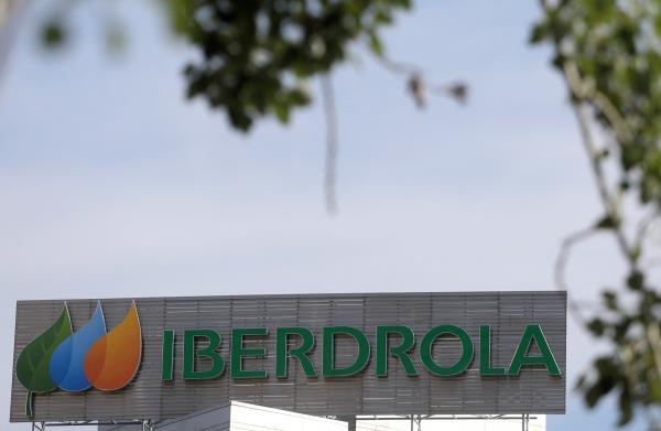 The logo of Spanish utility company Iberdrola is seen outside its headquarters in Madrid