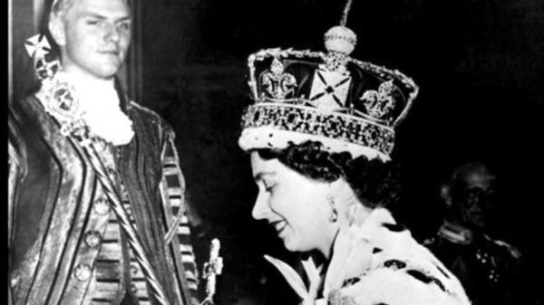 FILE - In this June 2, 1953 file photo, Britain's Queen Elizabeth II wearing the bejeweled Imperial Crown and carrying the Orb and Scepter with Cross, leaves Westminster Abbey, London, at the end of her coronation ceremony. On Monday Feb. 6, 2017, Queen Elizabeth II marks her Sapphire Jubilee, becoming the first British monarch to reign for 65 years. (AP Photo/File)