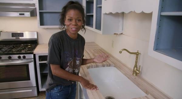 Keyanna Bowen with a portable brass faucet