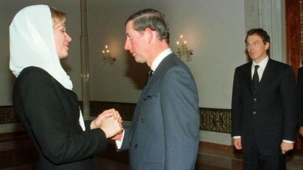 Britain's Prince Charles pays his condolences to American-born Queen Noor, widow of Jordan's King Hussein, while British Prime Minister Tony Blair (R) looks on at an Amman royal palace after the funeral of his late husband February 8. King Hussein was laid to rest by a nation steeped in grief and by a galaxy of world leaders who came to pay homage to a pivotal figure in the quest for Middle East peace. ES/WS
