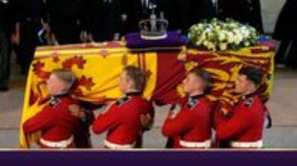The bearer party carries the coffin of Queen Elizabeth II into Westminster Hall, London, where it will lie in state ahead of her funeral on Monday. Picture date: Wednesday September 14, 2022.