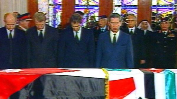 British Prime Minister Tony Blair (3rd L) and Prince Charles (R) stand with Leader of the Opposition William Hague (L) and Leader of the Liberal Democrats Paddy Ashdown (2ndL) before the flag-draped coffin of Jordan's King Hussein as they pay their respects at the Ragadan Royal Palace February 8 