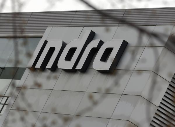 The logo of Spanish technology company Indra is seen on the top of its headquarters in Alcobendas