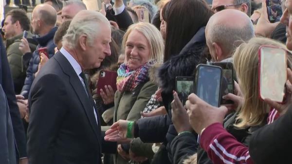 King Charles meets members of the public waiting outside Westminster Hall where the Queen's lying in state is taking place.