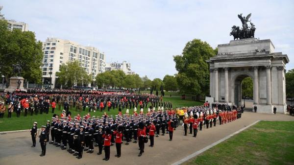 The coffin of Britain's Queen Elizabeth is carried through Wellington Arch in the procession on the day of Her state funeral and burial, in London, Britain, September , 2022 REUTERS/Toby Melville
