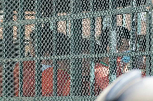People on a prison truck arrive at the Phnom Penh Municipal Court in Phnom Penh, Cambodia, on Thursday, Sept. 15, 2022 