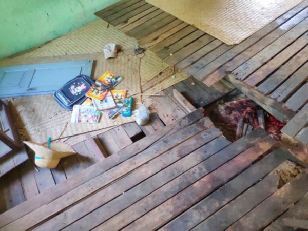Children's school books scattered across a floor stained with blood at a school in Myanmar's Sagaing region that was attacked by army helicopters.