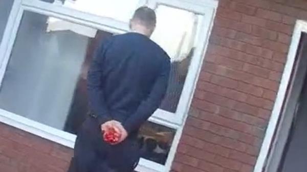 Crosbie's blood-soaked hands can be seen in the footage. Pic: Norfolk Police