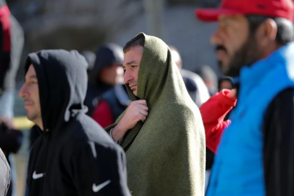 Russians lineup after crossing the border at Verkhny Lars between Georgia and Russia in Georgia