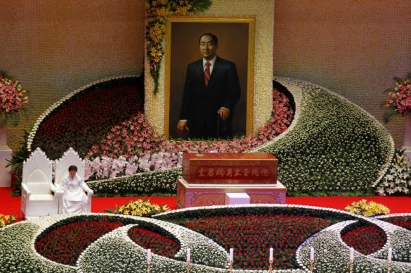 Han Hak-ja, widow of Evangelist Reverend Sun-Myung Moon, sits beside the coffin of Moon during a funeral service for the late, founder of the Unification Church, at the CheongShim Peace World Center in Gapyeong